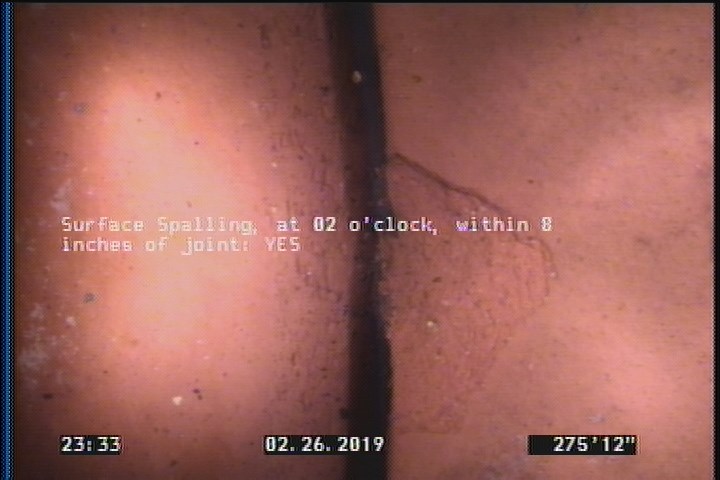 Surface Spalling, at 02 o'clock, within 8 inches of joint: YES