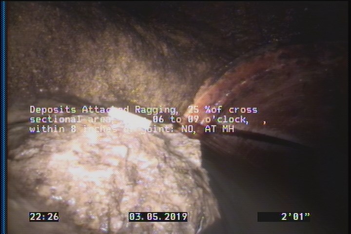 Deposits Attached Ragging, 25 %of cross sectional area, from 06 to 09 o'clock, , within 8 inches of joint: NO - AT MH