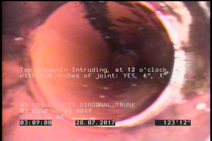 Tap Break-In Intruding, at 12 o'clock, -, -, within 8 inches of joint: YES, 6", 1"