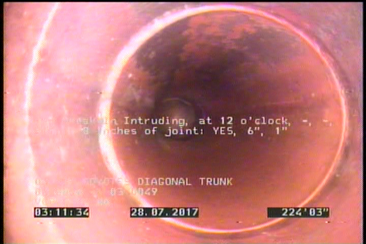Tap Break-In Intruding, at 12 o'clock, -, -, within 8 inches of joint: YES, 6", 1"