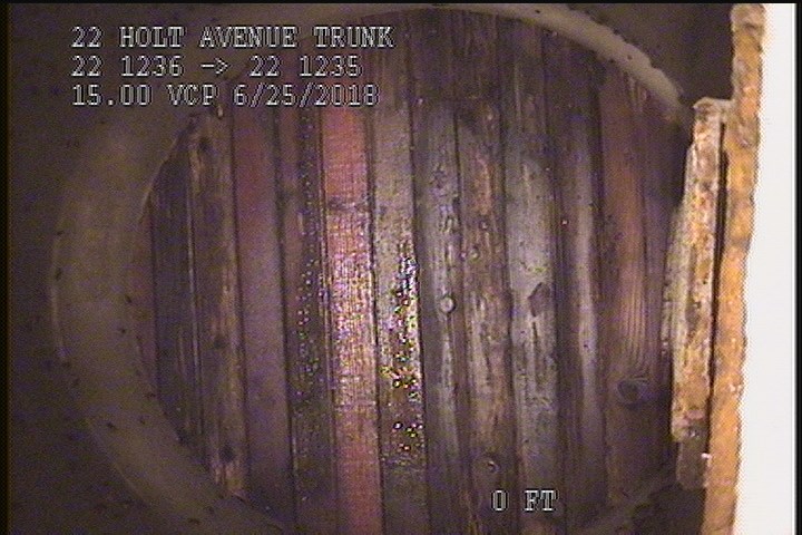 General Observation - WOOD PLANKS ON MH CONSTRUCTION IN AREA
