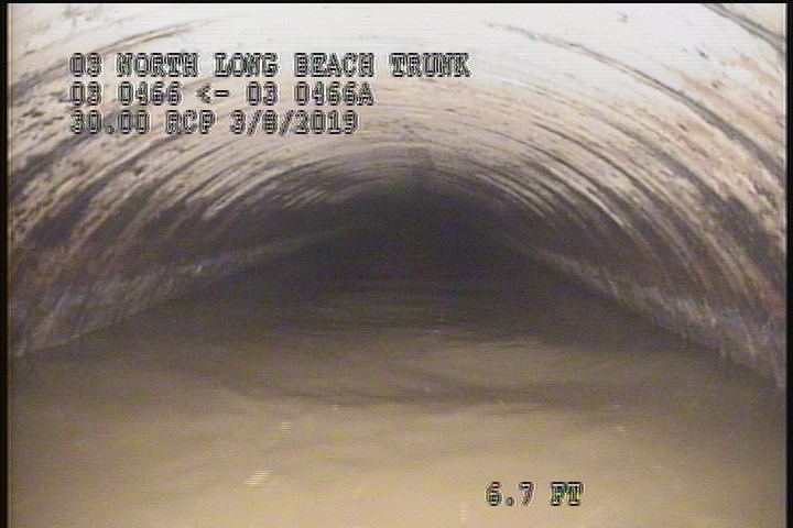 Downstream Manhole, Survey Begins - 9:25 AM