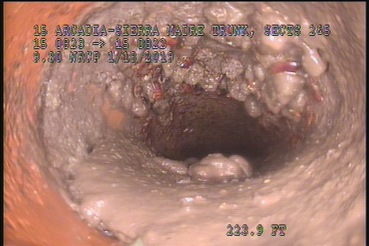 Tap Break-In, at 03 o'clock, -, within 8 inches of joint: YES, 4" - Open/50% GREASE/LATERAL