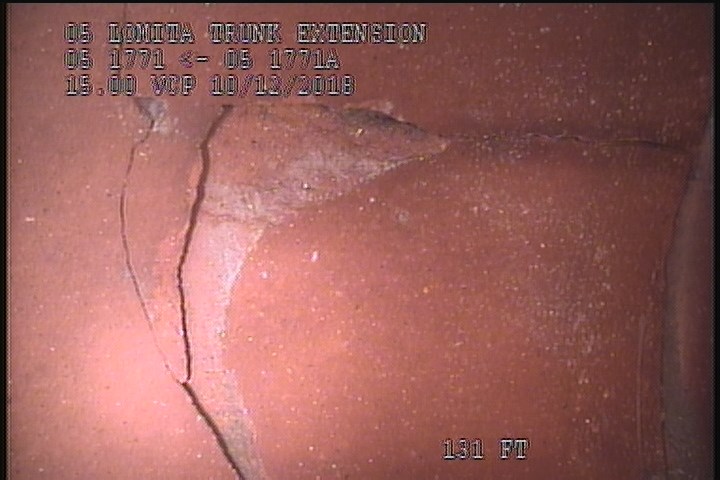 Broken, from 08 to 10 o'clock, within 8 inches of joint: YES - SLIGHT FRACTURE INDENTED