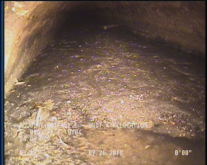 Deposits Settled Other, 40 %of cross sectional area, from 03 to 09 o'clock, , within 8 inches of joint: YES - SLUDGE/DEBRIS