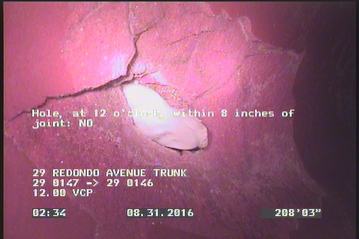 Hole, at 12 o'clock, within 8 inches of joint: NO - W/ REPAIR VISIBLE