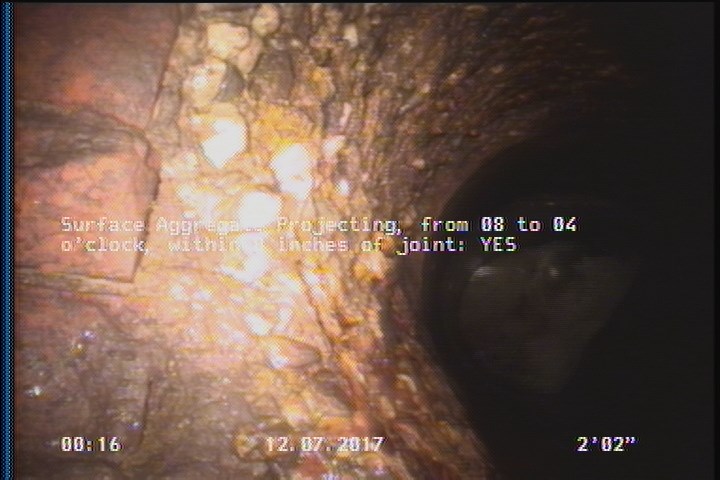 Surface Aggregate Projecting, from 08 to 04 o'clock, within 8 inches of joint: YES