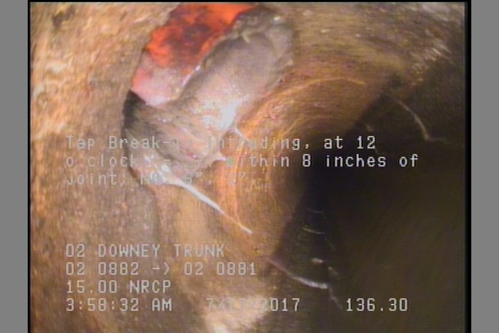Tap Break-In Intruding, at 12 o'clock, -, -, within 8 inches of joint: NO, 6", 2"