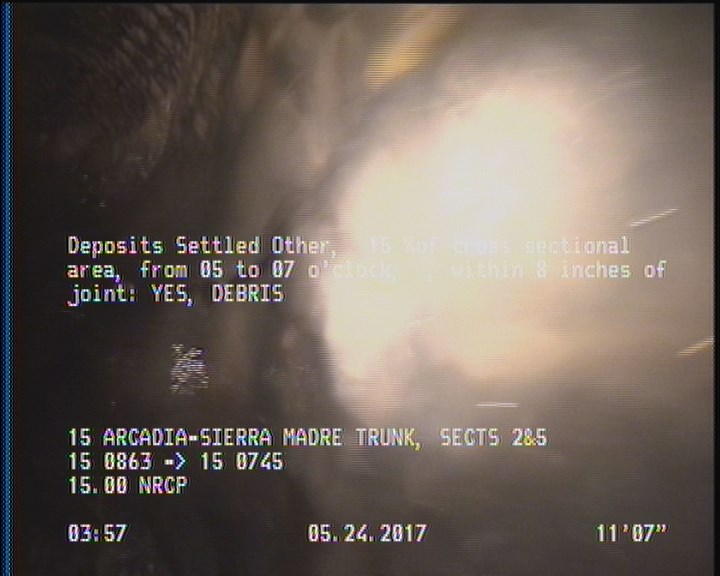 Deposits Settled Other, 15 %of cross sectional area, from 05 to 07 o'clock, , within 8 inches of joint: YES - DEBRIS