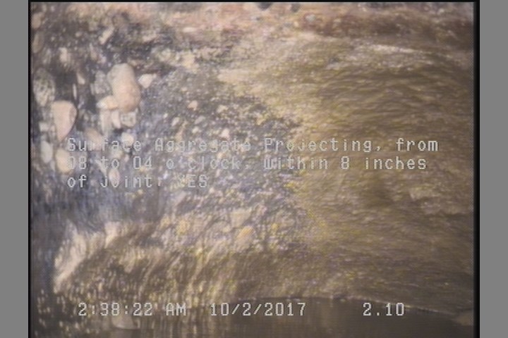 Surface Aggregate Projecting, from 08 to 04 o'clock, within 8 inches of joint: YES