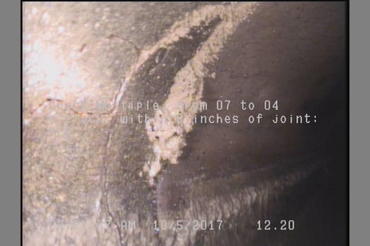 Crack Multiple, from 07 to 04 o'clock, within 8 inches of joint: YES