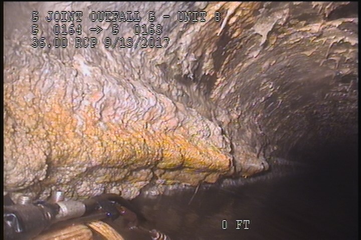 Deposits Attached Grease, 10 %of cross sectional area, from 07 to 08 o'clock, , within 8 inches of joint: NO, Start - INSIDE MH