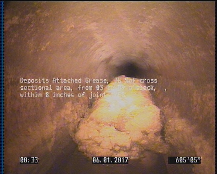 Deposits Attached Grease, 35 %of cross sectional area, from 03 to 09 o'clock, , within 8 inches of joint: YES