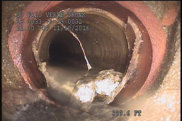 General Observation - DEFECTIVE ACTIVE CONN. INSIDE THE MH. @ 03 O'CLOCK, 35% DEBRIS, AND POSSIBLY BROKEN JUST PAST THE LINER