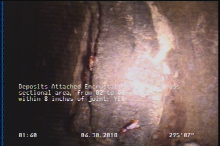 Deposits Attached Encrustation, 10 %of cross sectional area, from 02 to 05 o'clock, , within 8 inches of joint: YES