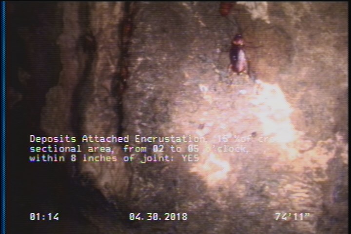 Deposits Attached Encrustation, 15 %of cross sectional area, from 02 to 05 o'clock, , within 8 inches of joint: YES