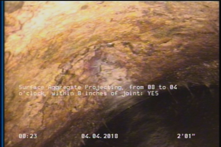 Surface Aggregate Projecting, from 08 to 04 o'clock, within 8 inches of joint: YES