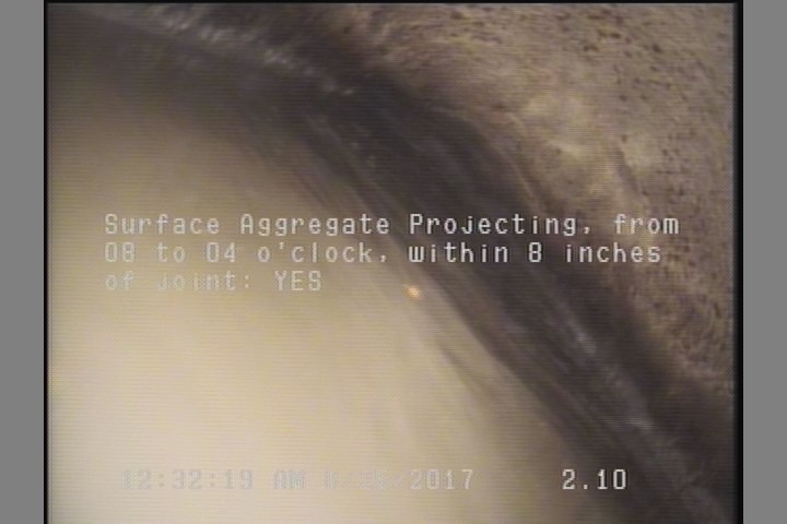 Surface Aggregate Projecting, from 08 to 04 o'clock, within 8 inches of joint: YES