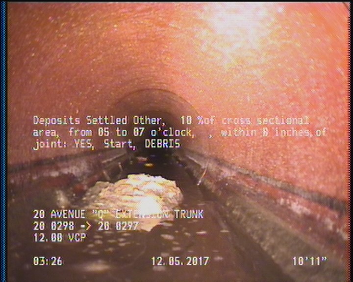 Deposits Settled Other, 10 %of cross sectional area, from 05 to 07 o'clock, , within 8 inches of joint: YES, Start - DEBRIS