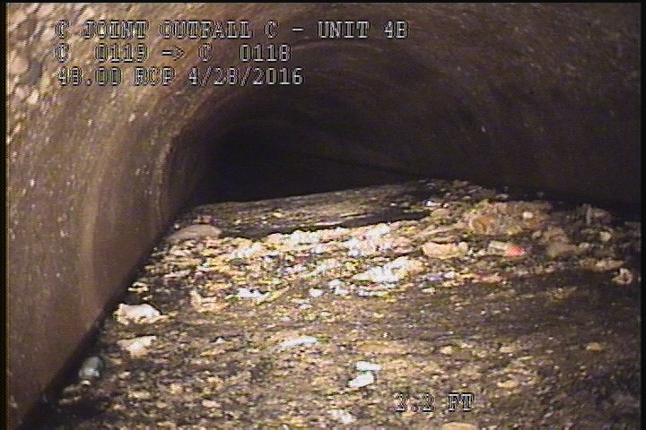 Deposits Settled Other, 30 %of cross sectional area, from 04 to 08 o'clock, , within 8 inches of joint: YES - SLUDGE & DEBRIE-APPOX 15' LONG