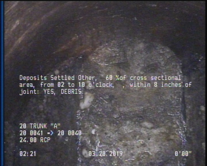 Deposits Settled Other, 60 %of cross sectional area, from 02 to 10 o'clock, , within 8 inches of joint: YES - DEBRIS