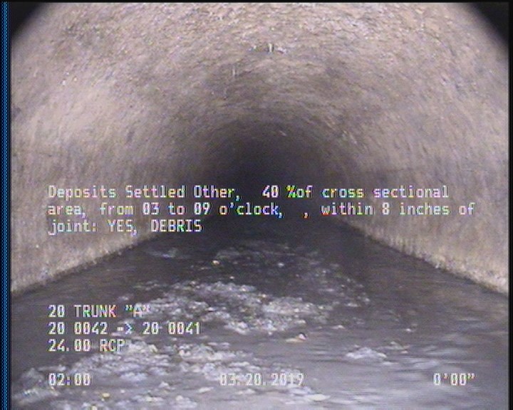 Deposits Settled Other, 40 %of cross sectional area, from 03 to 09 o'clock, , within 8 inches of joint: YES - DEBRIS