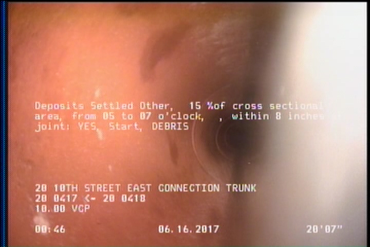 Deposits Settled Other, 15 %of cross sectional area, from 05 to 07 o'clock, , within 8 inches of joint: YES, Start - DEBRIS