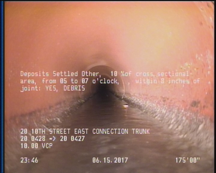 Deposits Settled Other, 10 %of cross sectional area, from 05 to 07 o'clock, , within 8 inches of joint: YES - DEBRIS