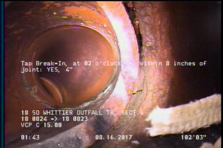 Tap Break-In Intruding, at 02 o'clock, -, -, within 8 inches of joint: YES, 4", 2"