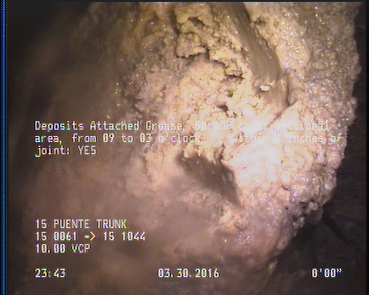 Deposits Attached Grease, 50 %of cross sectional area, from 09 to 03 o'clock, , within 8 inches of joint: YES