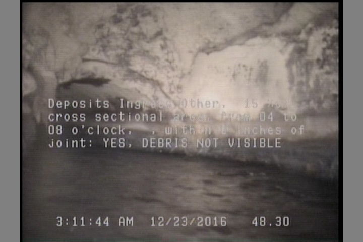 Deposits Ingress Other, 15 %of cross sectional area, from 04 to 08 o'clock, , within 8 inches of joint: YES - DEBRIS NOT VISIBLE