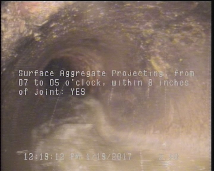 Surface Aggregate Projecting, from 07 to 05 o'clock, within 8 inches of joint: YES