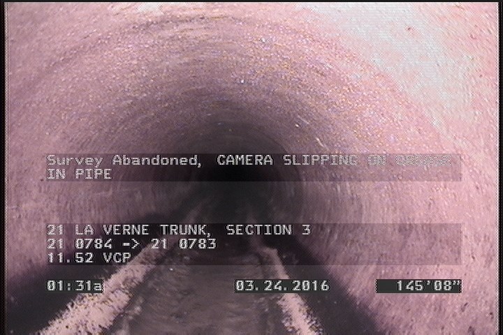 Survey Abandoned - CAMERA SLIPPING ON GREASE IN PIPE