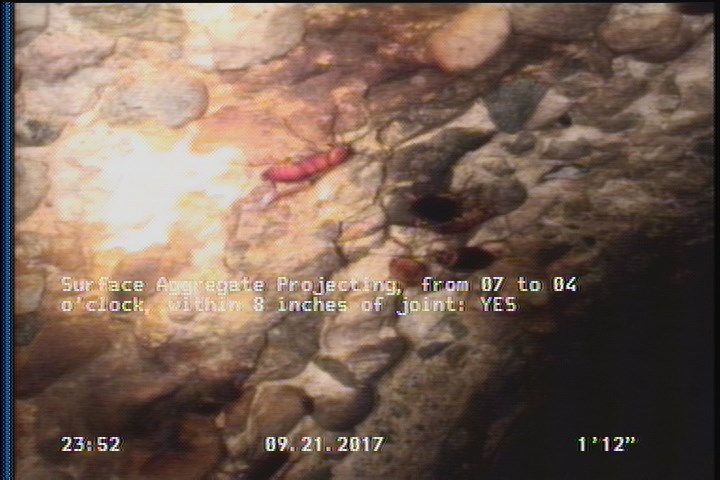 Surface Aggregate Projecting, from 07 to 04 o'clock, within 8 inches of joint: YES