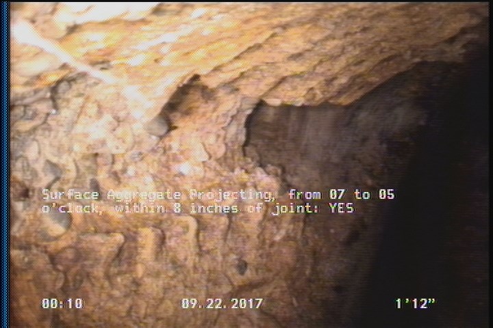 Surface Aggregate Projecting, from 07 to 05 o'clock, within 8 inches of joint: YES