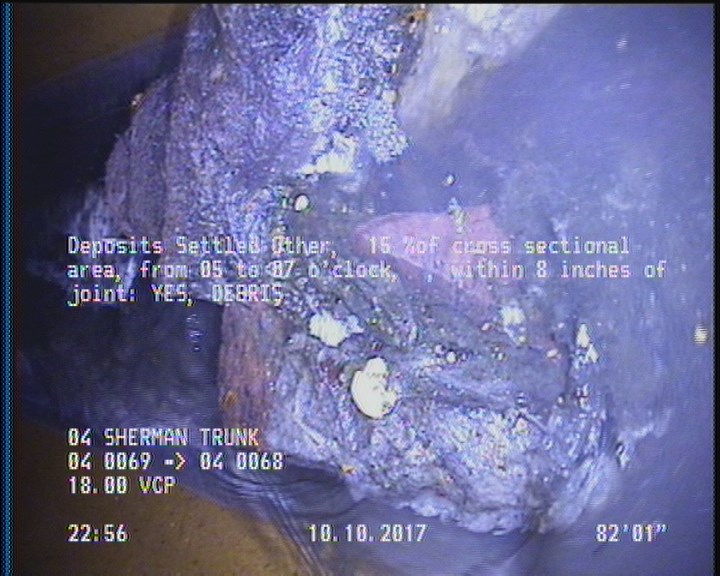 Deposits Settled Other, 15 %of cross sectional area, from 05 to 07 o'clock, , within 8 inches of joint: YES - DEBRIS