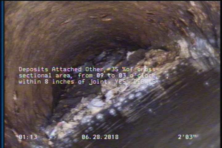 Deposits Attached Other, 35 %of cross sectional area, from 09 to 03 o'clock, , within 8 inches of joint: YES - DEBRIS