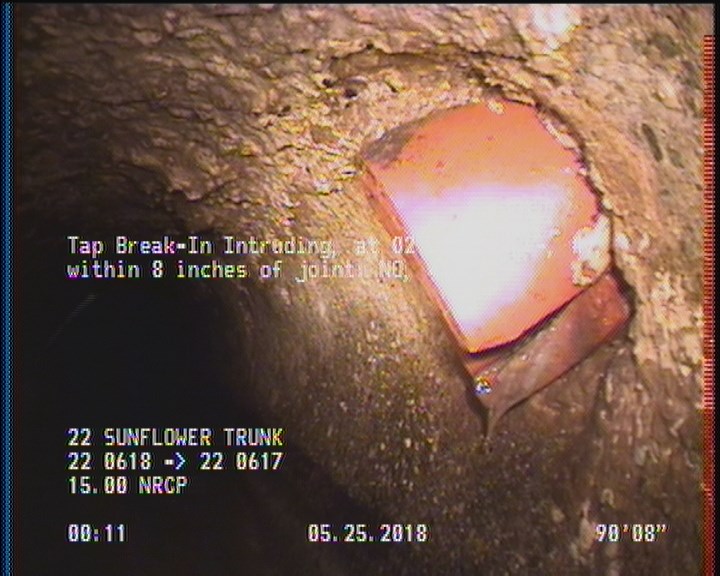 Tap Break-In Intruding, at 02 o'clock, -, #v, within 8 inches of joint: NO, 4", 2"