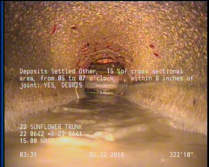 Deposits Settled Other, 15 %of cross sectional area, from 05 to 07 o'clock, , within 8 inches of joint: YES - DEBRIS