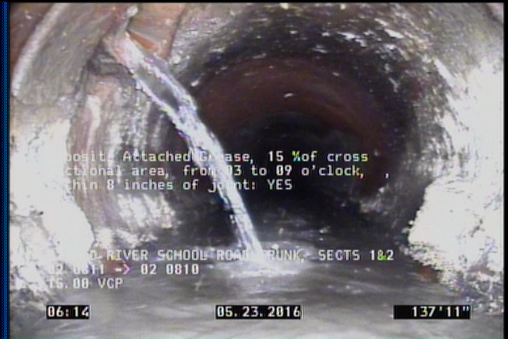 Deposits Attached Grease, 15 %of cross sectional area, from 03 to 09 o'clock, , within 8 inches of joint: YES
