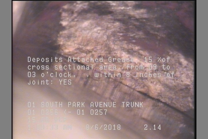Deposits Attached Grease, 15 %of cross sectional area, from 09 to 03 o'clock, , within 8 inches of joint: YES
