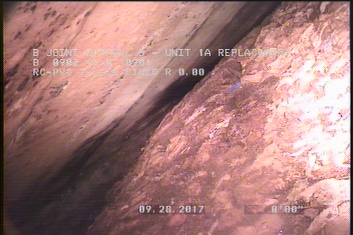 Deposits Settled Other, 40 %of cross sectional area, from 09 to 03 o'clock, , within 8 inches of joint: NO - SLUDGE AT SIPHON