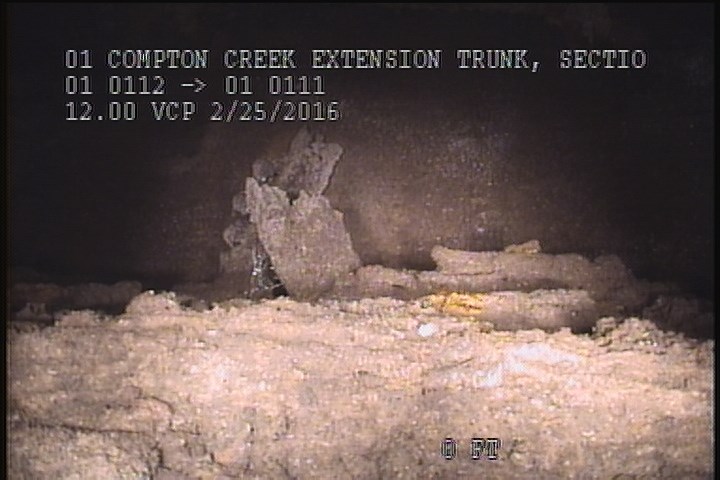 General Observation - DIRT/GREASE/DEBRIS ON TOP OF THE SHELVES INSIDE THE MH.