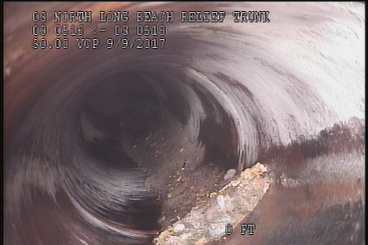 Deposits Settled Gravel, 5 %of cross sectional area, from 05 to 07 o'clock, , within 8 inches of joint: YES