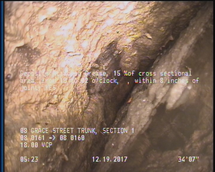 Deposits Attached Grease, 15 %of cross sectional area, from 10 to 02 o'clock, , within 8 inches of joint: YES