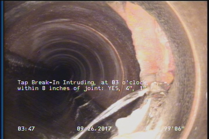 Tap Break-In Intruding, at 03 o'clock, -, -, within 8 inches of joint: YES, 4", 1"