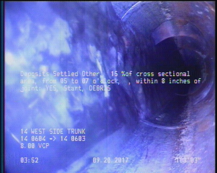 Deposits Settled Other, 15 %of cross sectional area, from 05 to 07 o'clock, , within 8 inches of joint: YES, Start - DEBRIS