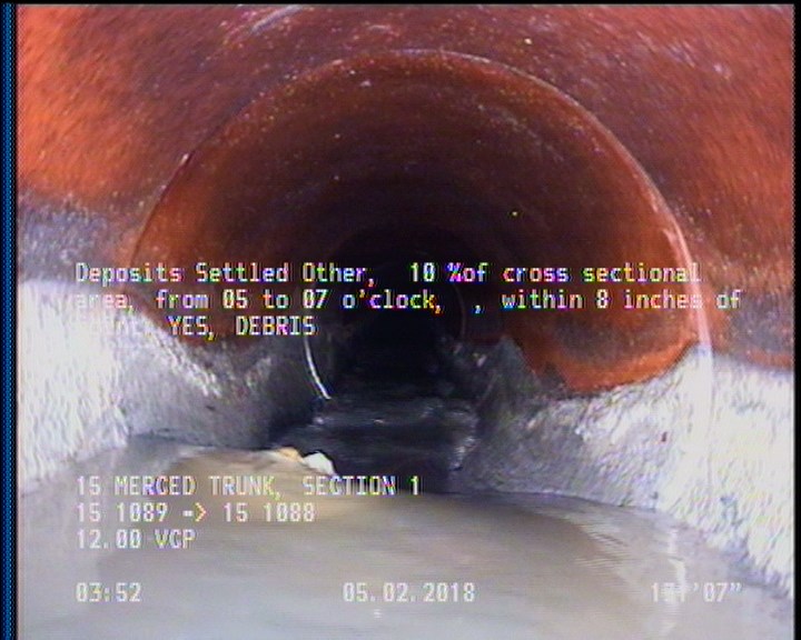 Deposits Settled Other, 10 %of cross sectional area, from 05 to 07 o'clock, , within 8 inches of joint: YES - DEBRIS