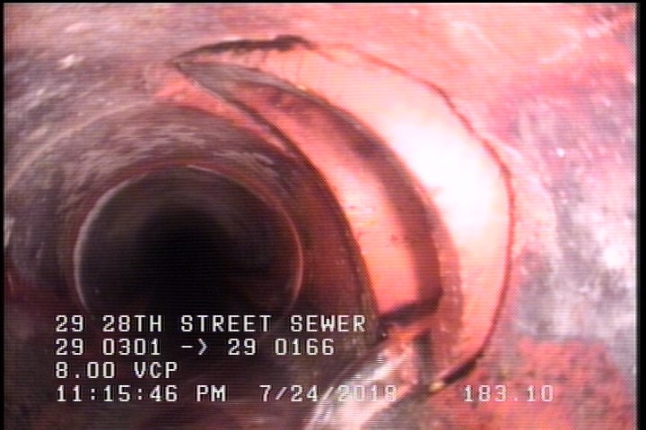 Tap Break-In Intruding, at 02 o'clock, -, -, within 8 inches of joint: YES, 6", 1"