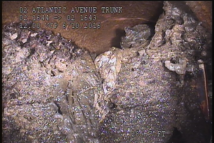 Tap Factory Made Defective, at 02 o'clock, -, within 8 inches of joint: YES, 6" - Open 80% BLOCKED ROOTS